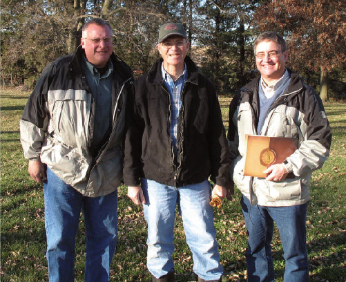 Pictured: Doyle Hostelter with Farmers Coop, Dave Doeschot of Pella Farms, and Nick Swantek of Hubbard Feeds, Inc